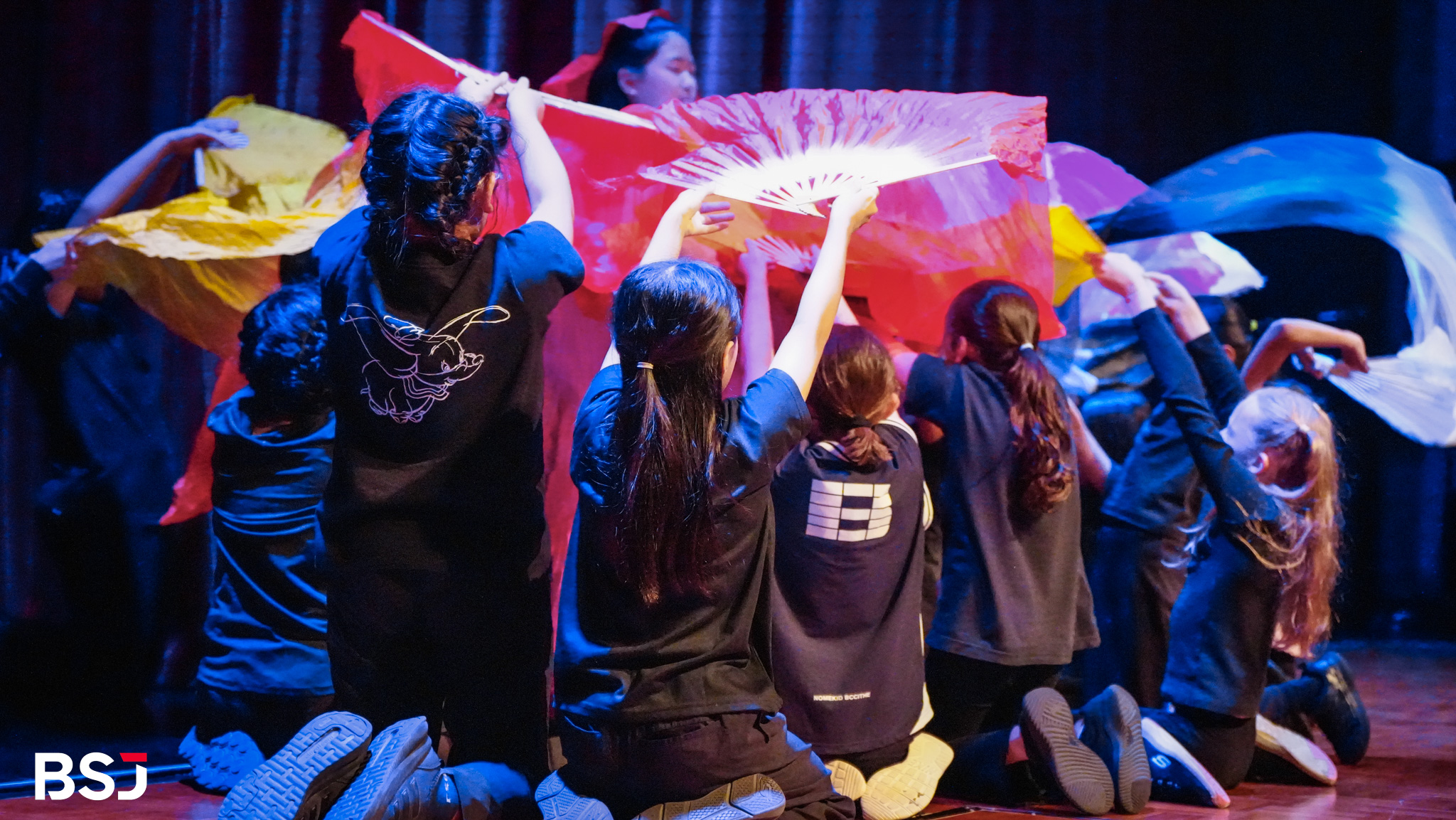 BSJ students showcasing visual art pieces during the event